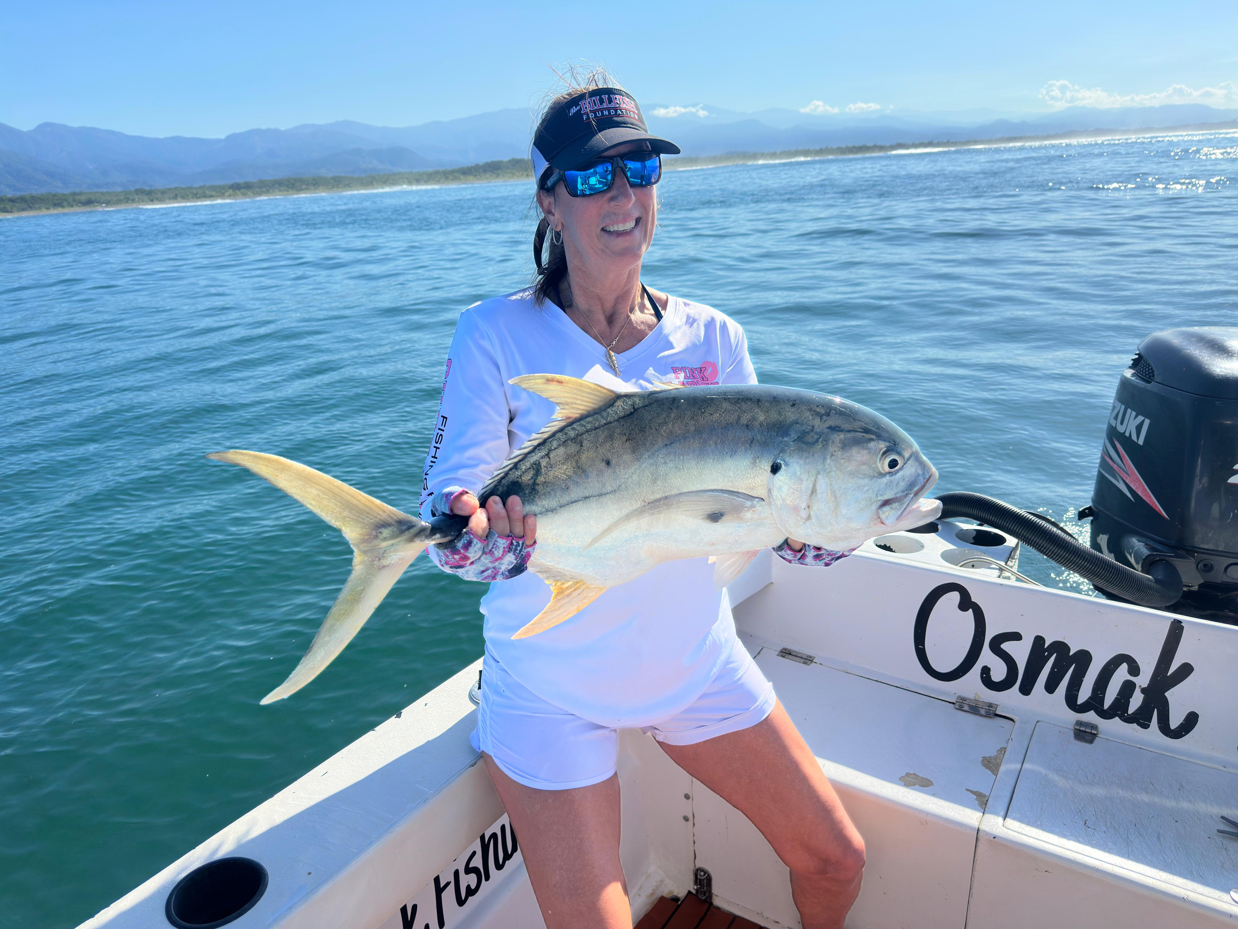 Angler with jack crevalle on the boat