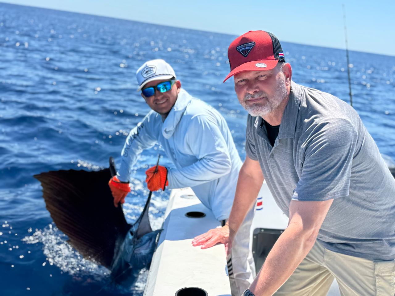 Captain Oscar and client with sailfish release
